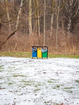 Trash bins in a park designed for trash segregation. Environment photo