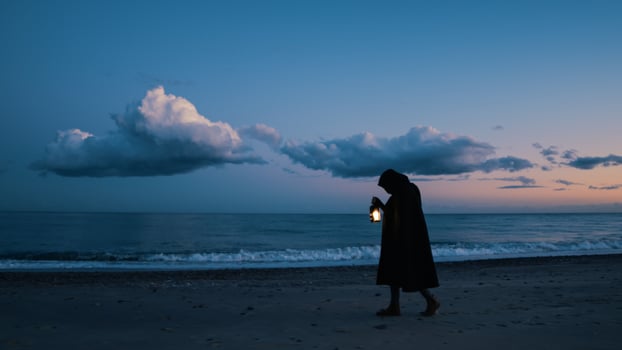 Lone Seeker Walks the Edge of the sea Waves photo