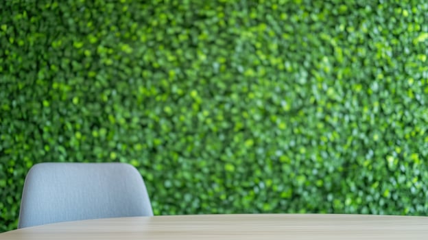 Modern Eco-Friendly Office Space With Green Plant Wall And Minimalist Furniture For Sustainable Work Environment And Employee Wellbeing In Contemporary Workplace Design photo