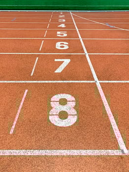 Running tracks and finish line in outdoor sport stadium photo