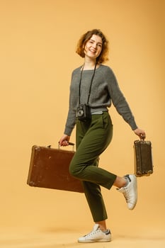 travel woman with a retro suitcase photo