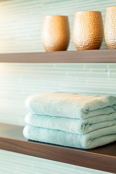 High-end spa interior featuring serene decor and relaxing atmosphere with luxurious towels and terracotta candles for a calming experience photo