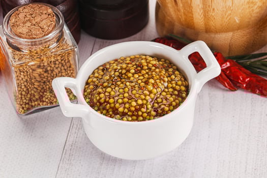 Spicy mustard sauce with seeds photo