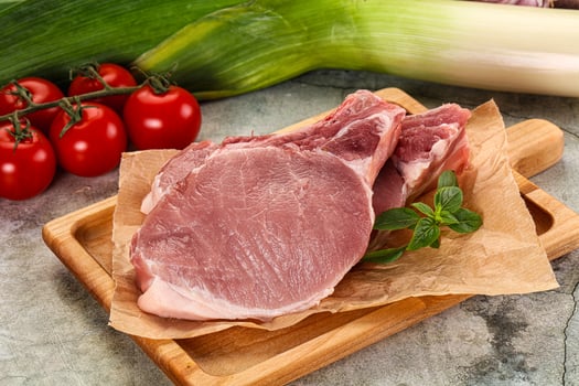 Raw pork steak loin with bone photo