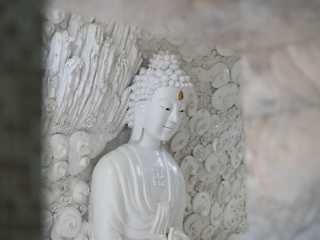 Marble sculpture symbolizing Buddhism in Asia inside temple. photo