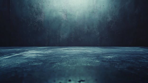 A dark, empty room with a blue wall photo