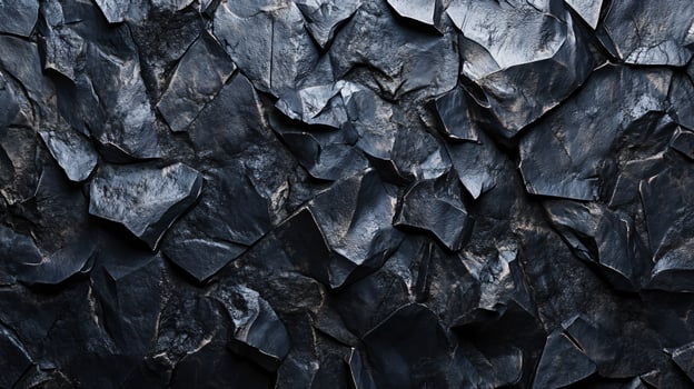 A close up of a rock wall with many different sized rocks photo