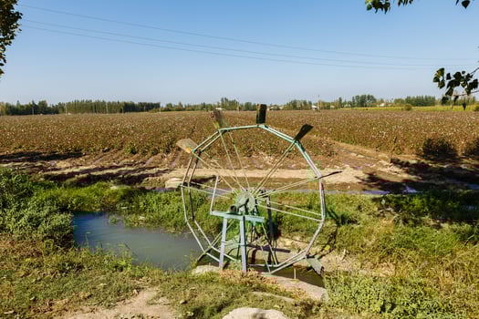 Water turbine on a cotton field. photo