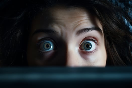 Mysterious eyes peering out from the darkness photo