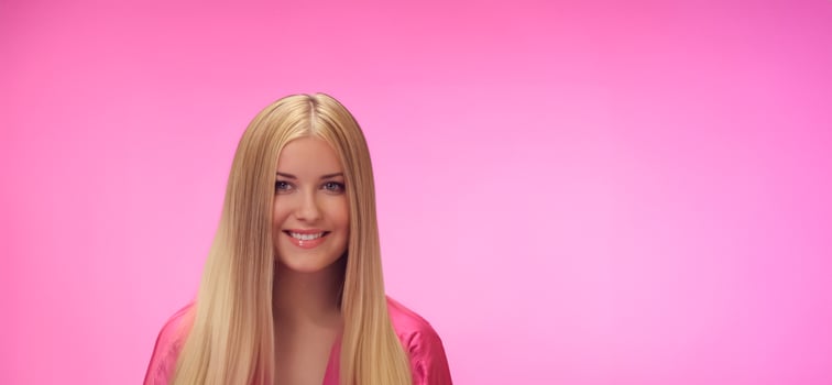 Woman, pink background, glamour and style. Blonde beautiful woman, long hair and radiant skin, fashion and confidence photo