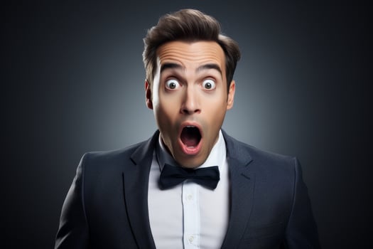 Surprised businessman in formal attire photo