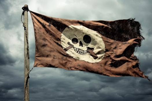 Pirate flag waving against stormy sky photo