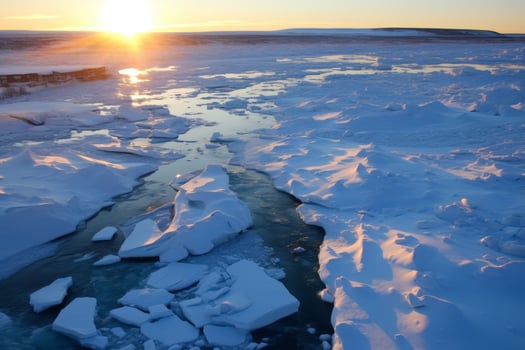 Frozen lake at sunset with snow covered shore photo