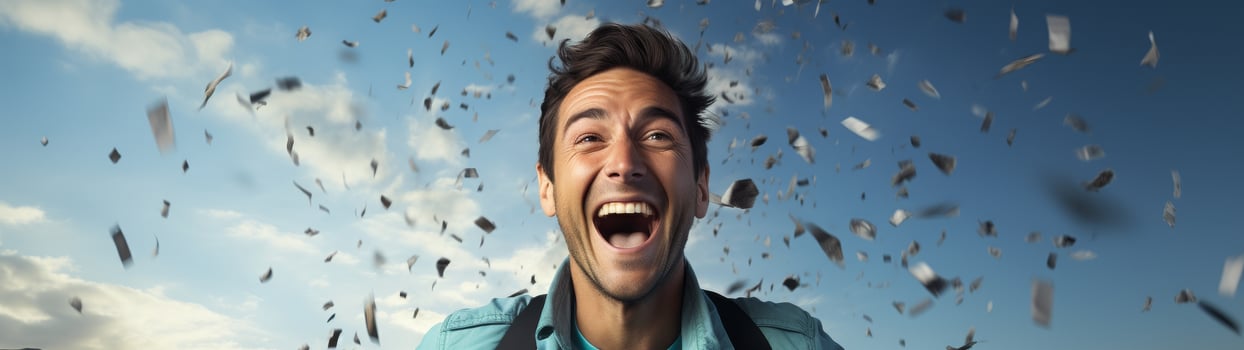 excited man surrounded by confetti photo