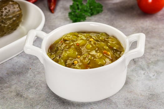 Souce gherkin relish with marinated cucumbers photo