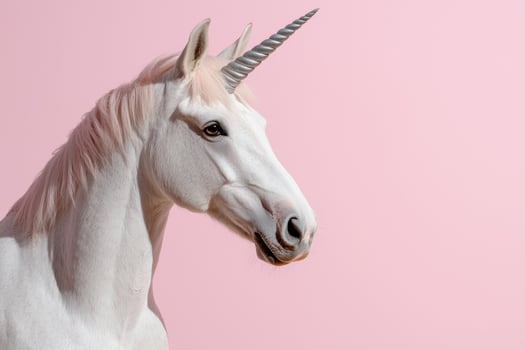 White unicorn with silver horn against pink background photo