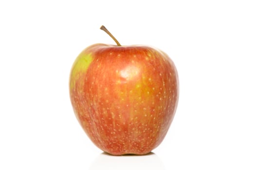 Vibrant red apple resting on a clean white surface showcasing its natural beauty and freshness for all to see photo