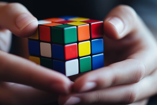 Partially Solved Rubik's Cube in Hand Close-Up photo