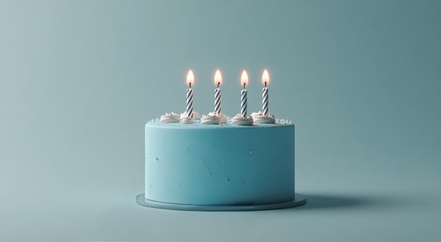 Blue birthday cake with candles on top photo