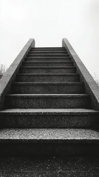 Black and white photograph of stairs leading up to a hill photo