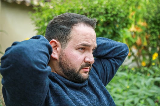 Man Relaxing On A Bench And Looking Forward photo