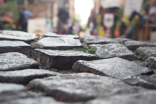 Textured Cobbled Streets that Effortlessly Showcase a Worn and Distinctive Aesthetic Appeal photo