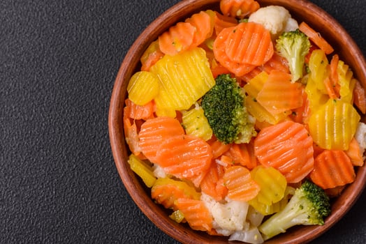 Delicious fresh vegetables steamed carrots, broccoli, cauliflower photo