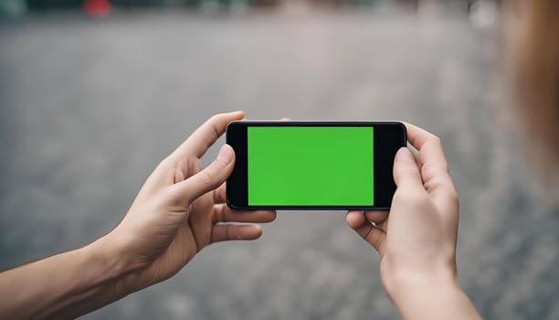 Person holding a smartphone with a green screen, Mockup for a digital application photo