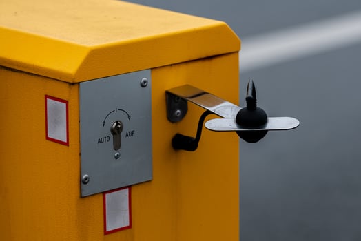 Yellow barrier control device for access management in a parking area photo