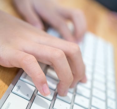 The girl is typing the keyboard photo