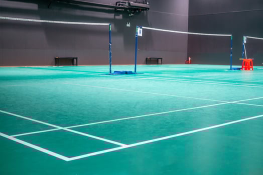 Empty green badminton court for playing photo