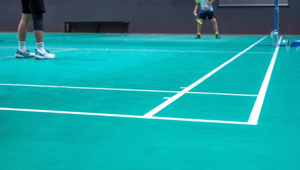 men are playing badminton indoor photo