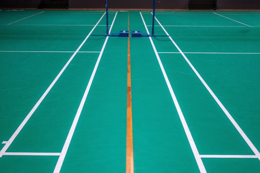 Empty green badminton court for playing photo