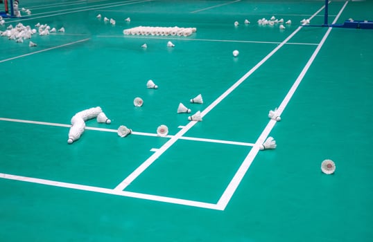 teacher are teaching student in the badminton court photo