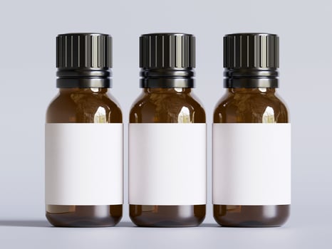 Three empty bottles of essential oil on a white background photo
