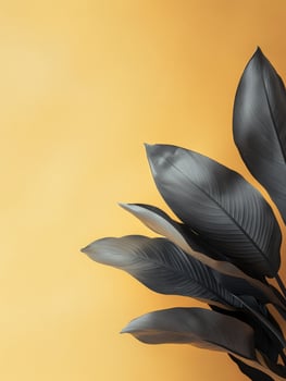 A close-up of dark leaves against a vibrant yellow background, creating a modern aesthetic. photo