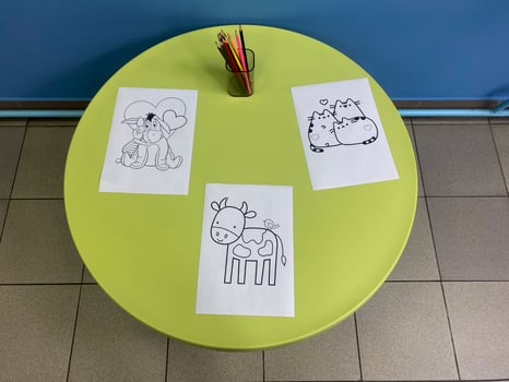 Round table for children with drawings photo