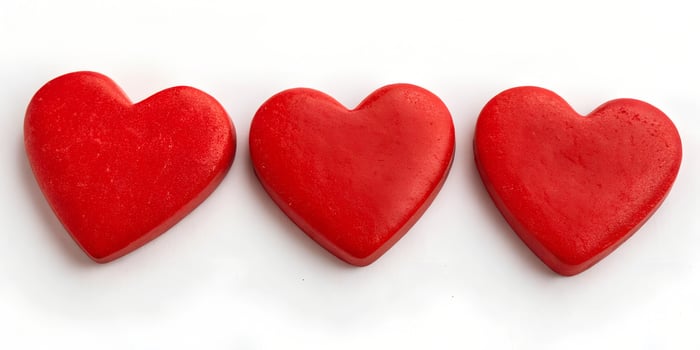 Red heart shape isolated on white photo