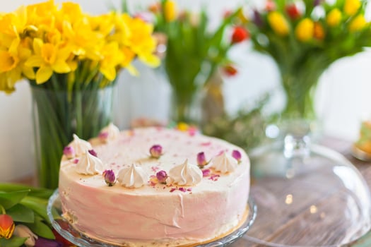Beautiful cake and spring flowers photo