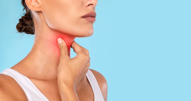 Healthcare, Cold and People Concept. Closeup of unrecognizable sick woman suffering from sore throat, ill lady touching neck with hand, inflamed red zone, banner, panorama, free copy space photo