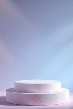 two pale cylindrical platforms on pink surface photo