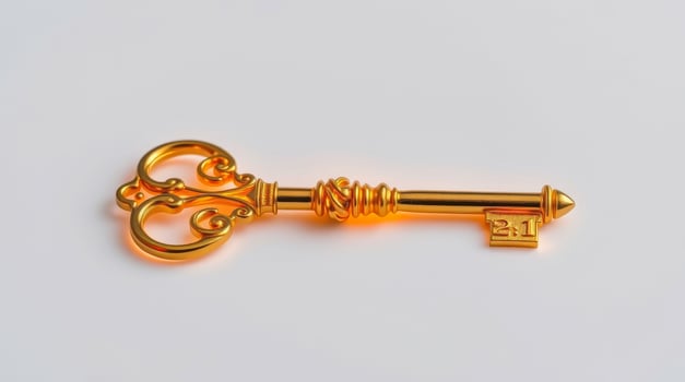ornate golden key on white background photo