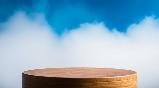 round wooden display surface against blue white background photo