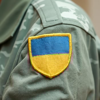 military uniform with a blue yellow cloth emblem photo