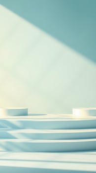 two white cylindrical platforms light-blue steps a minimalist setting photo