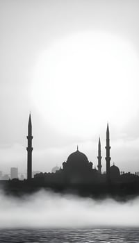 A silhouette of a Middle Eastern city skyline featuring domed buildings and tall minarets against a foggy, gray background during early morning with soft light illuminating the fog photo