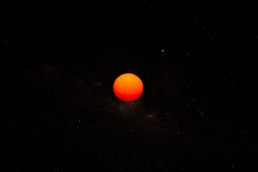 The sun in the dark background. photo