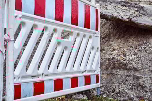 Plastic fencing of a dug pit on construction site photo