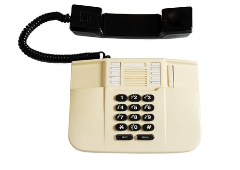 Landline corded push-button telephone isolated on white background photo