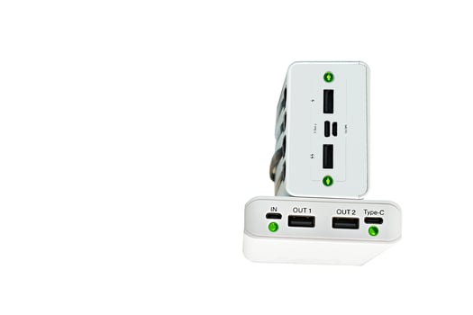 Two power banks with green light for charging various gadgets, phones photo